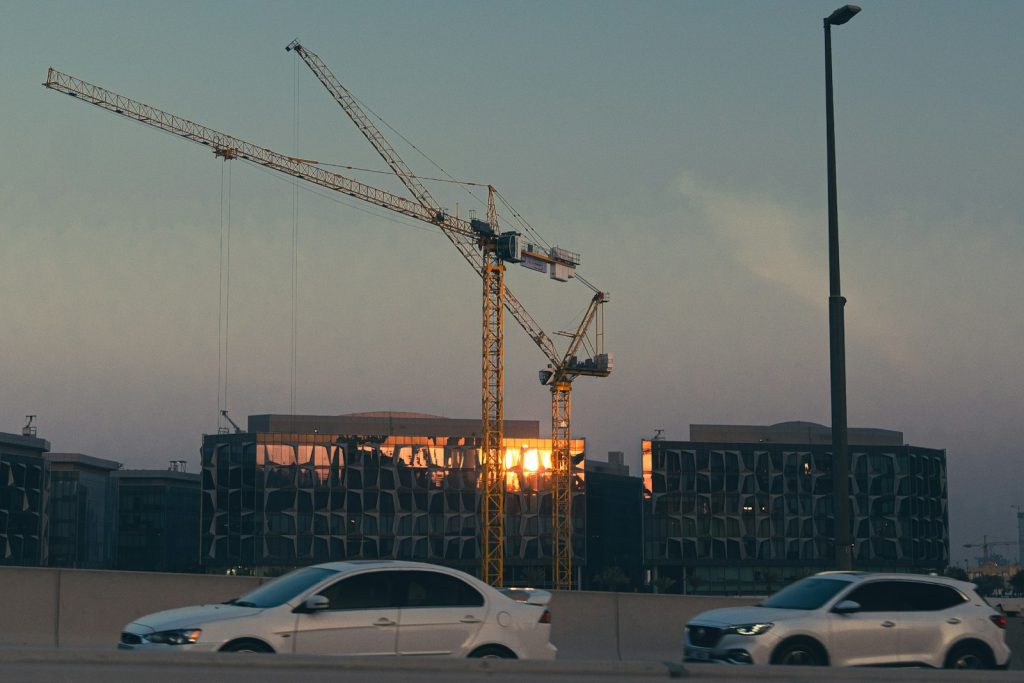 Construction cranes over a Dubai residential project, the type of off-plan property used for Golden Visa applications
