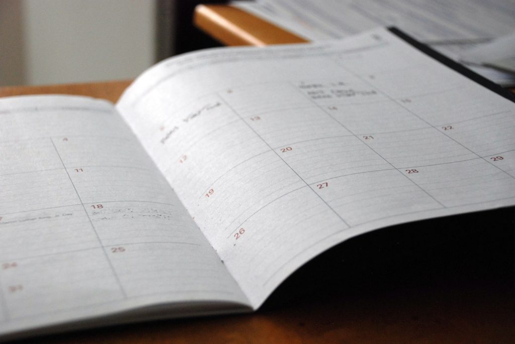 Open planner on a desk, a reminder to start the Dubai property visa renewal before the permit expires